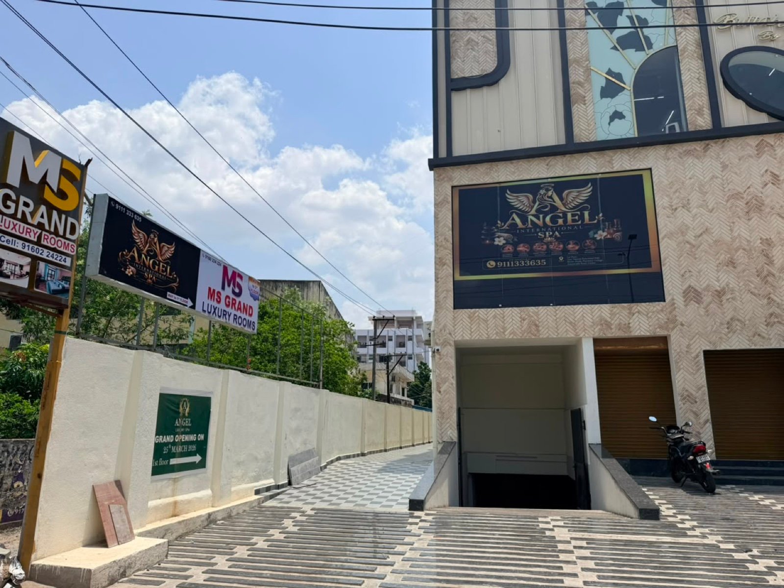 Angel International Spa exterior signage at MS Grand Building, Guntur